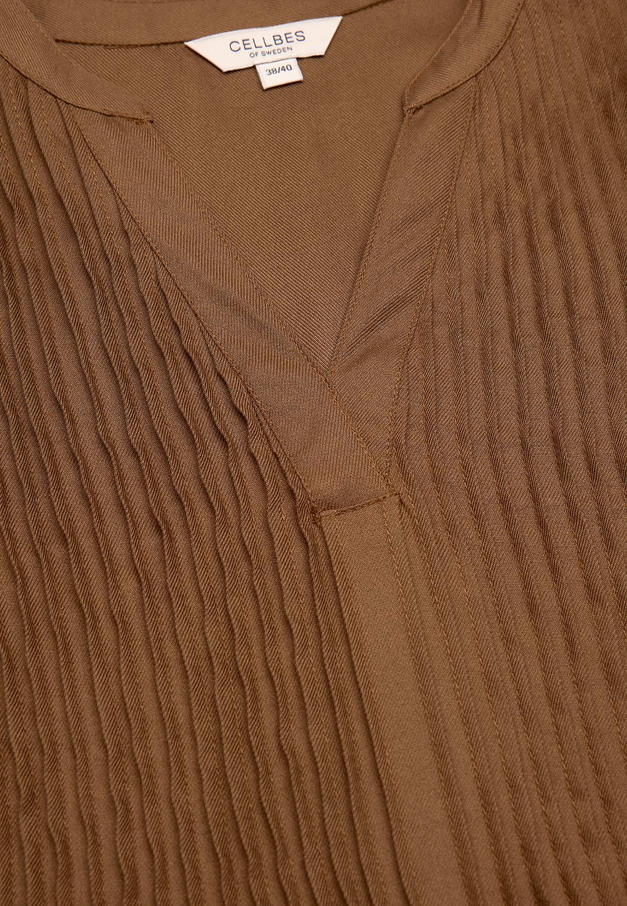 Bluse mit genähten Falten