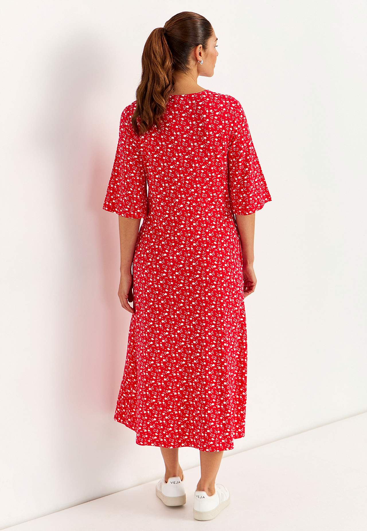 Jerseykleid mit einem Blumen-Muster und Taschen